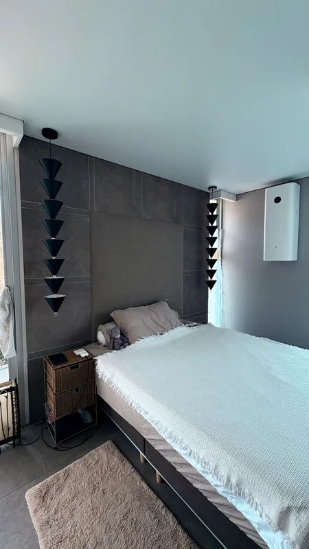 Finished bedroom with stretch ceiling and walls